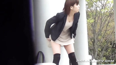 Sexy Asian doll was caught pissing in the street