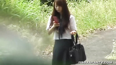 Girl spreads legs, lifts skirt up and rubs pussy