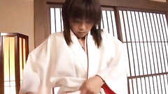 Babe in traditional clothes enjoys his skilled fingers
