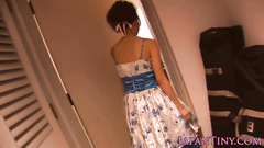 Precious young Japanese chick is showing off in sexy dress
